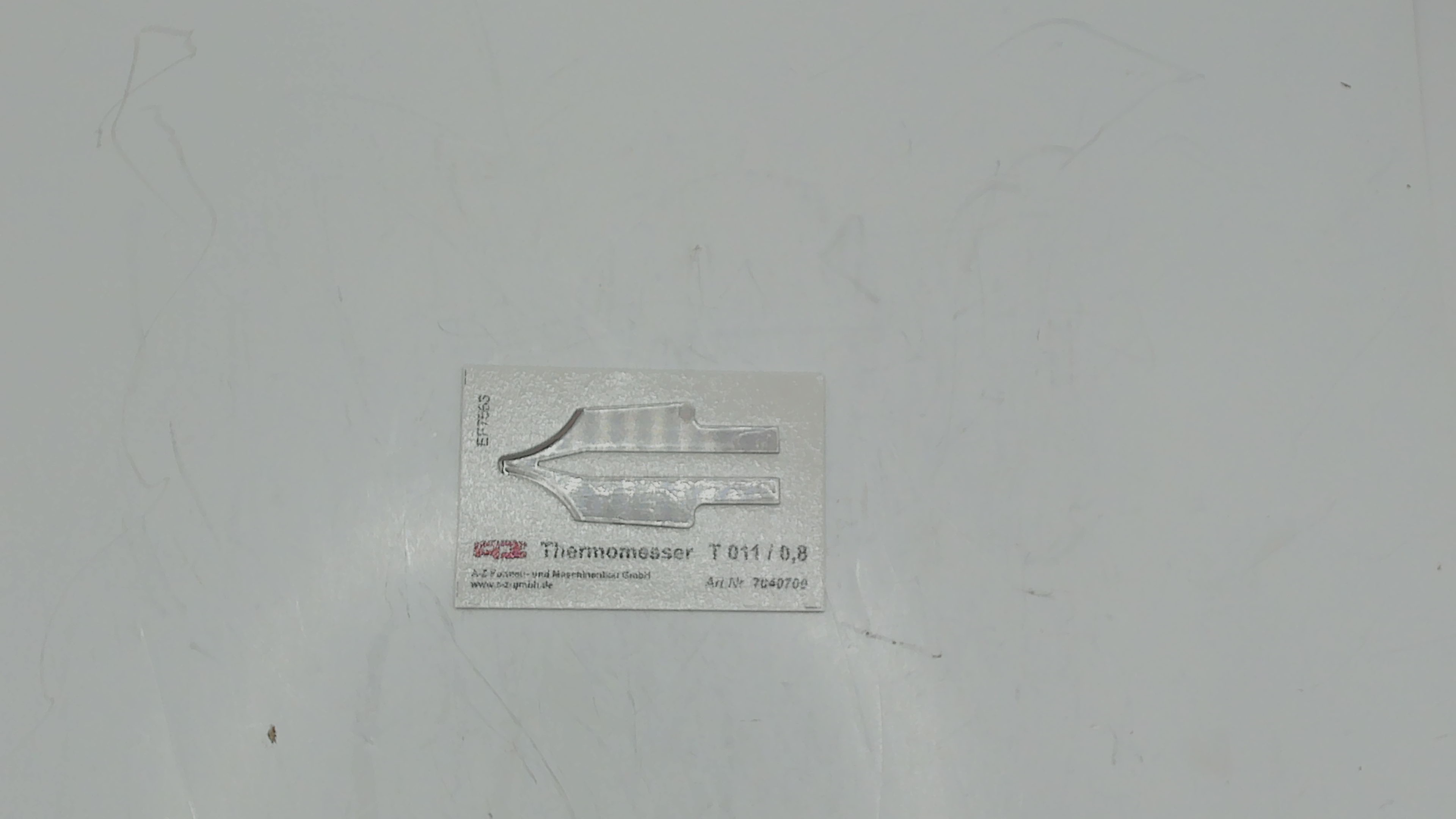 7040700